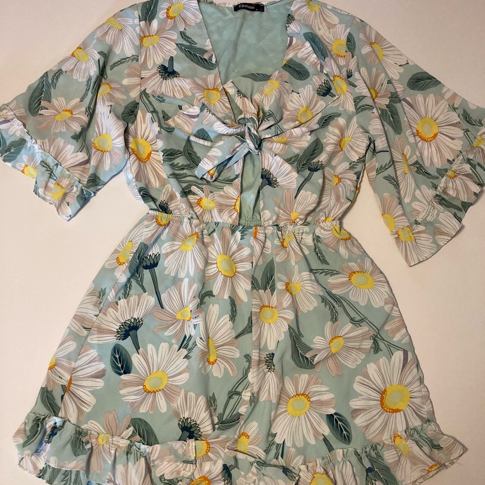 Daisy Print Jumpsuit turquoise with ruffled hem and tie chest. Size S